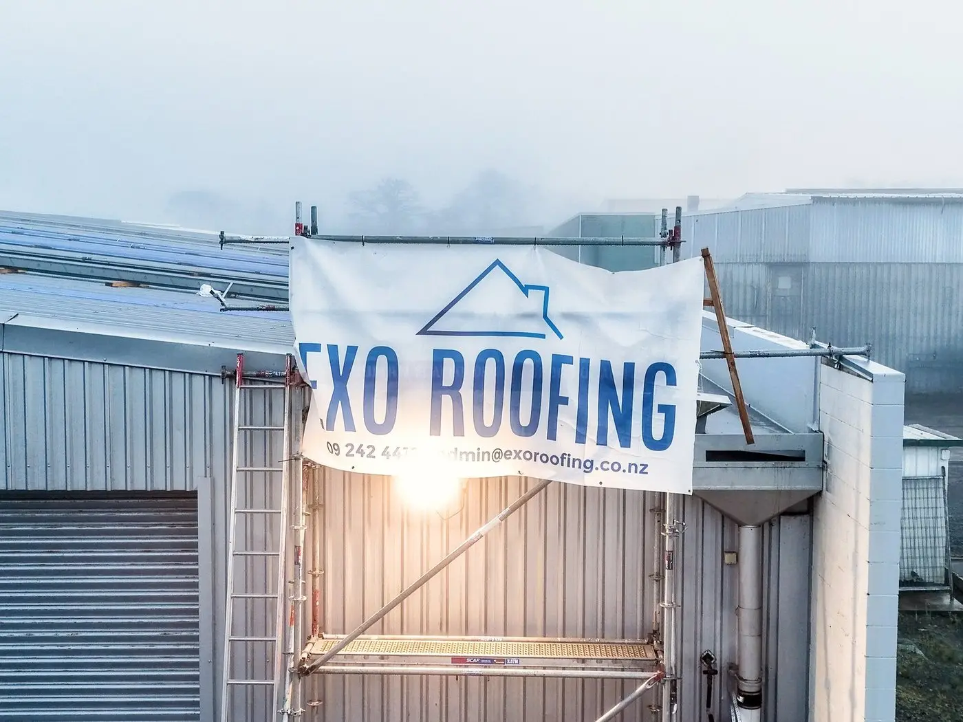 Commercial roof part-way through replacement, showing underlay and new longrun sheets